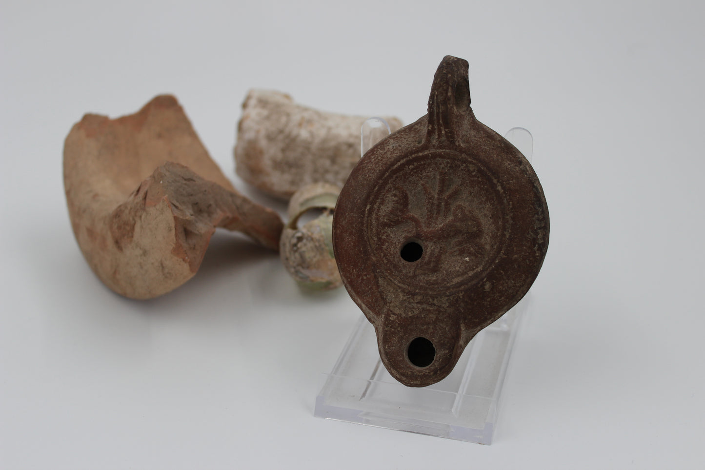 Mid-Imperial Mould-Made Oil Lamp with Dolphin Motif